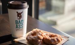 Malasada donuts and a cup of hot coffee