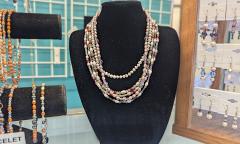 Displays of necklaces, bracelets, anklets, and earings