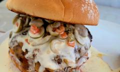 The Olive Burger topped with various cheeses and sauces