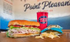 A cold sub, chips, and a drink