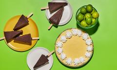 A whole key lime pie and chocolate dipped pie slices