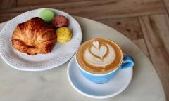 Croissant, macarons, and a hot latte