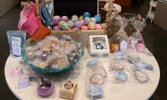 A table filled with various soaps and trinkets