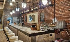 The interior and bar seating area at Pizzalley's on St. George Street