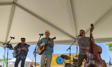 Lonesome Bert and the Thick and Thin String Band on an outdoor stage in St. Augustine.