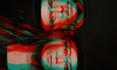 The core duo of Musical Chairs, in a art photo with superimposed images and colors