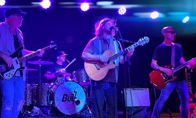 Contact Buzz, with all four members performing on stage
