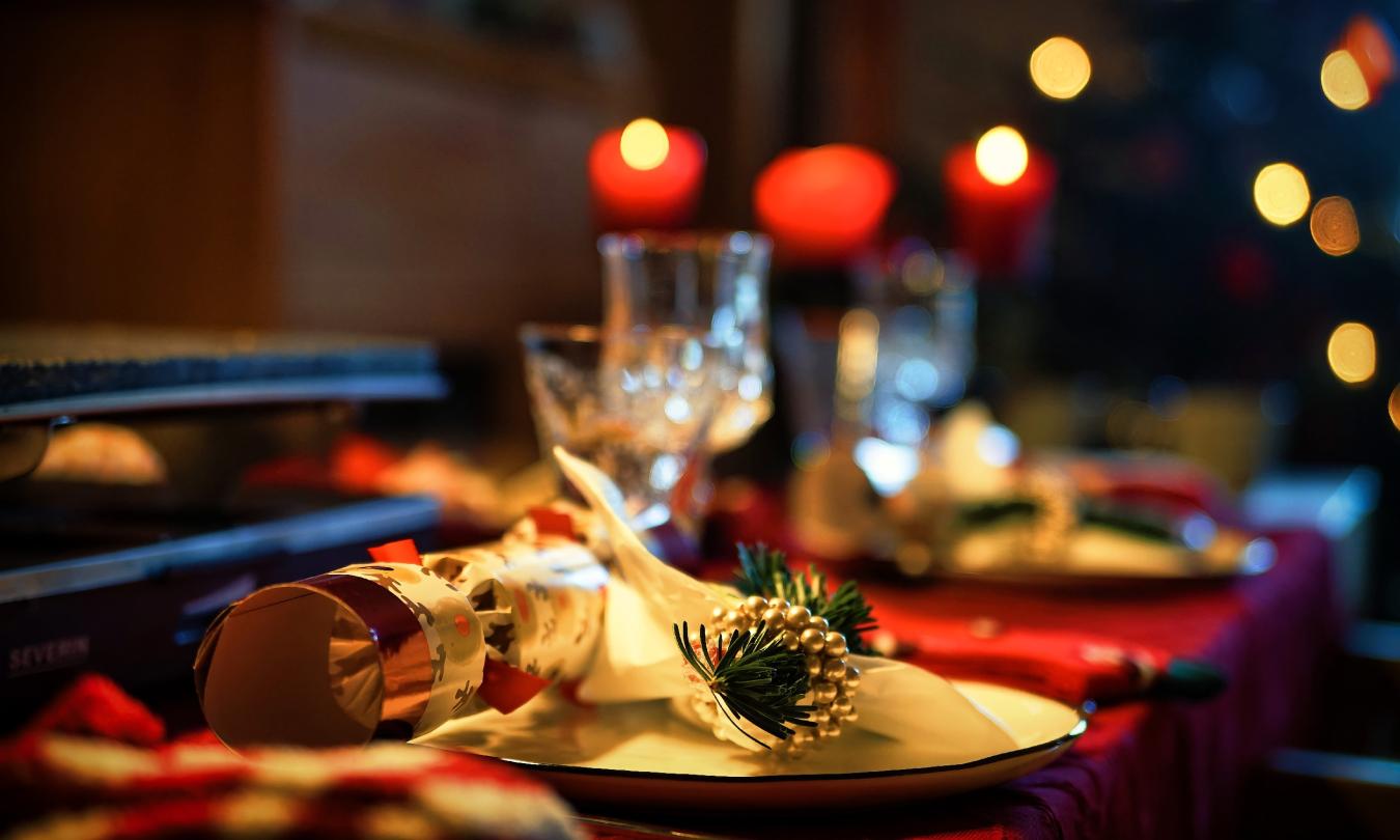 Placesettings at a table decorated for the Christmas holidays
