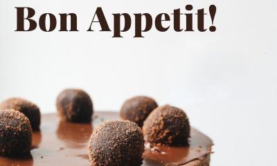 First Coast Opera Advertisement for Bon Appetit! Chocolate cake with bon bons on top 