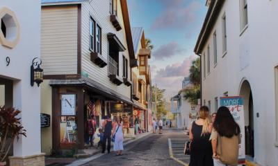 Art lovers browse the galleries on Aviles Street at the Friday Night Art Walk in St. Augustine, FL