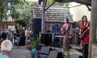 Bad Dog Mama playing for a crowd at the Colonial Oak Music Park on St. George Street