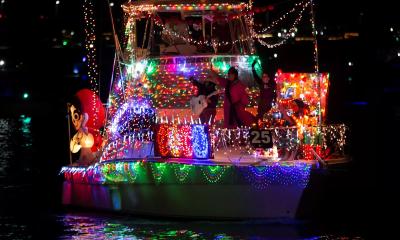 A large powerboat decorated with hundreds of holiday lights, and with a rock band on the bow for the Regatta of Lights boat parade in historic St. Augustine