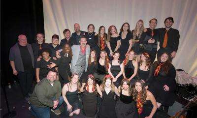 Three rows of the Key of Seas student choir at Flagler College
