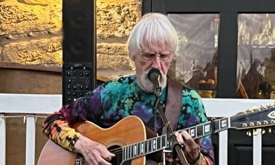 singer songwriter Bob Paterson playing his 12-string guitar