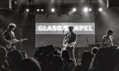 The three members of Glass Chapel on stage in black and white