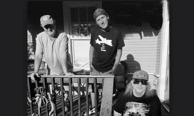 F Bombs trio standing together on a porch