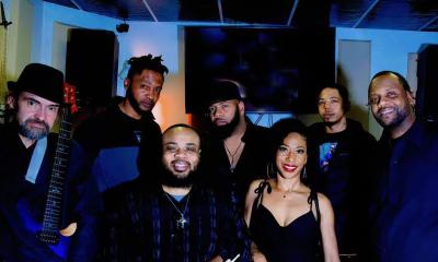 The band Soulfull Roots standing together onstage