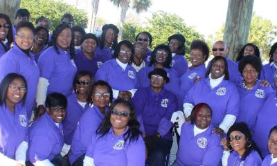The Tri-Cpunty Gospel Chorale standing together outdoors.