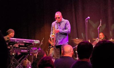 Marcus Click on Stage with a band