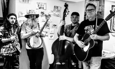 Tom Haney Band, holding instruments