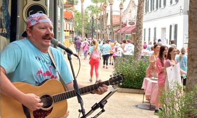 Ben Haley performing on St. George Street for Pink Up the Pace in 2025
