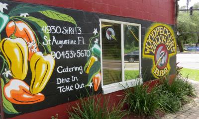 The bright exterior of Woodpecker's Backyard BBQ on route 13, west of St. Augustine.