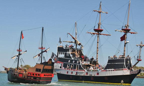 The Black Raven and the Queen Anne's Revenge engage in battle during the Oldest City Pirate Weekend in St. Augustine, Florida.