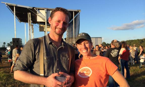 Zach Lynch from the St. Augustine Distillery enjoys the festival with a friend.