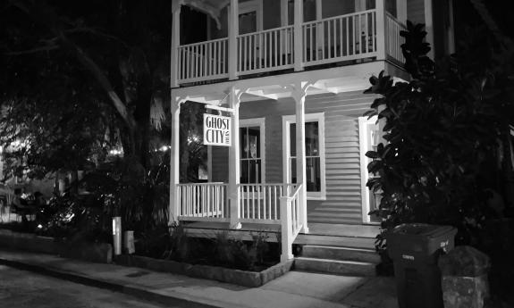 A black and white photo of the old building that's the home of Ghost City Tours