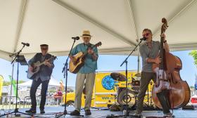 Lonesome Bert and the Thick and Thin String Band on an outdoor stage in St. Augustine.