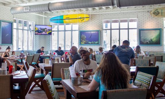 A view of the tables and guests inside Salt Life Food Shack.
