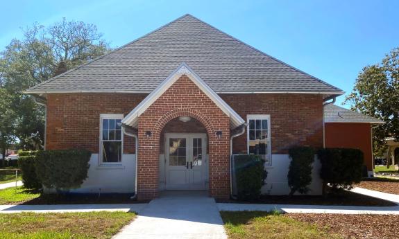 The historic St. Augustine Waterworks — a brick building against a blue sky.