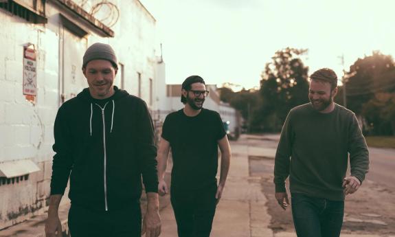 Stranger Wolf band walking down a street together