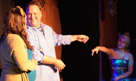 The cast onstage in costumes for the musical production of Big Fish at Limelight Theatre. 