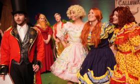 The cast onstage in costumes for the musical production of Big Fish at Limelight Theatre. 