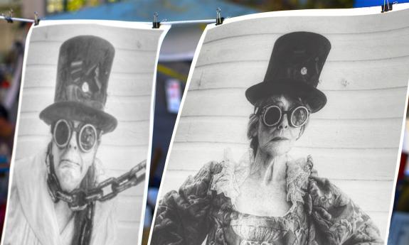 Two black and white photos of a man and a woman in Steampunk garb, hanging on a line, 