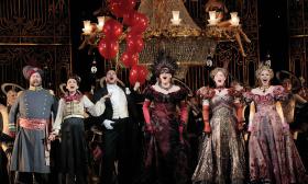 Die Fledermaus live performance with the actors in costume on the stage. 