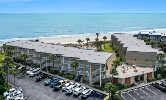 A drone photo of a condo complex located on Crescent Beach