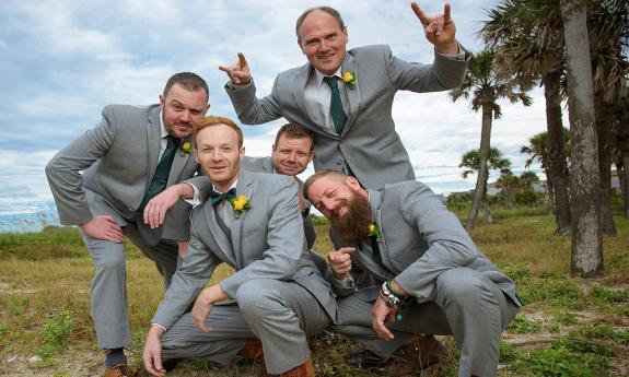 Groomsmen in formal wear.