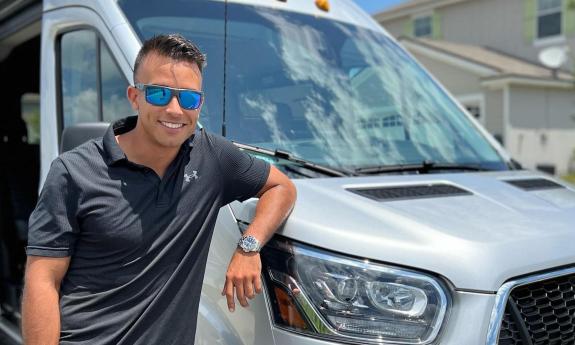 A parking staff member beside a vehicle
