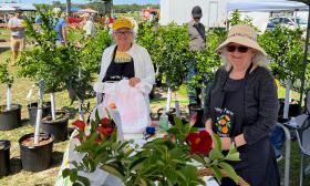 Two ladies at the Hartley Farm boot at the Flower and Garden Show by EPIC