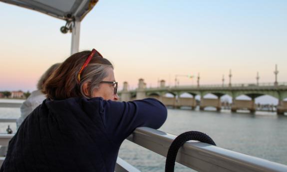 A woman viewing the Bridge of Lions from the deck of The St. Augustine Boat Tours