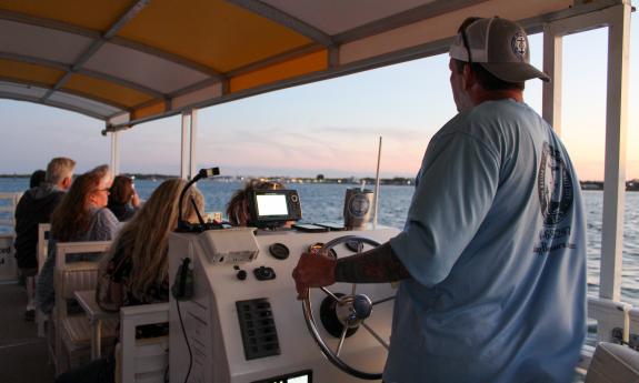 Captain Sean driving this vessel for a St. Augustine Boat Tours sunset cruise