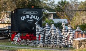 A row of striped prisoner mannequins toils in St. Augustine Florida