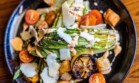 A grilled salad with shaved cheese as served at the Castillo Craft Bar + Kitchen in St. Augusitine