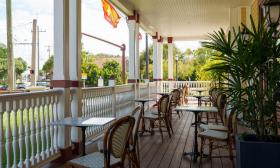 The Castillo Craft Bar + Kitchen offers seating on the covered porch for drinks or dining