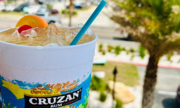 A large rum drink, garnished with fruit, at Crabby's Beachside in St. Augustine Beach