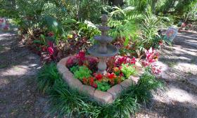 A heart-shaped garden with a small fountain, located in St. Johns Botanical Garden near St. Augustine