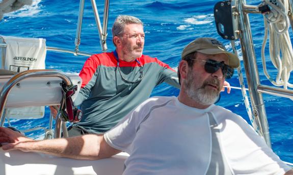 Captain Marty sailing Summerwind on a blue sea