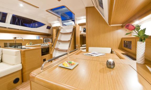 Belowdecks aboard the sailing yacht Summerwind, showing the chart table, galley, and companionway